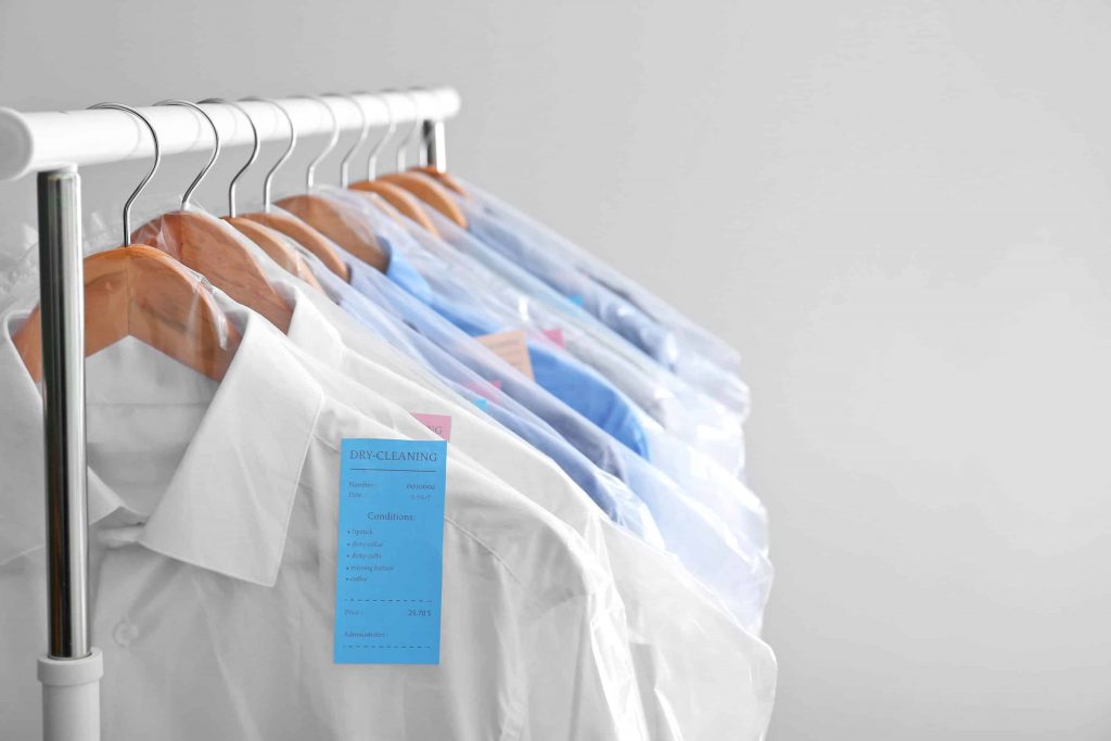 Neatly arranged shirts on a rack.