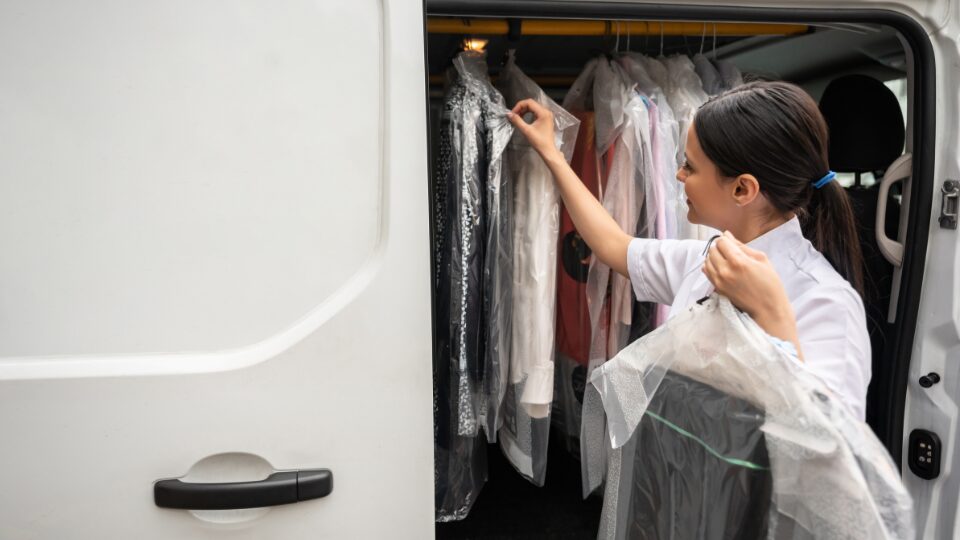 Woman delivering dry cleaned clothes