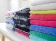 neatly folded laundry - fluff and fold cost