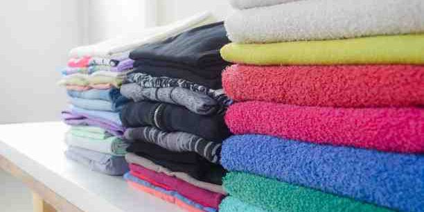 neatly folded laundry - fluff and fold cost